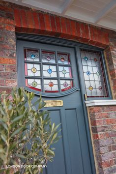 a green door with stained glass on it