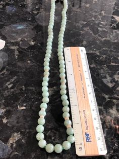 "Vintage Green Jade Beaded Necklace, 24\" Jade and 14K Gold. This beautiful jade necklace has 73 round light green jade beads along with a 14K gold clasp marked 14K 585 and 8 gold beads. We are fairly certain this was purchased in Hong Kong back in the 1980's as a gift for grandmother. It shows no real signs of wear. It comes with a craft gift box." Elegant Round Jade Beaded Necklaces, Jade Necklaces With Large Round Beads, Elegant Jade Jewelry With Large Beads, Elegant Jade Beaded Necklace With 8mm Beads, Large Jade Bead Jewelry, Jade Beaded Necklace With Polished Beads, Formal Jade Jewelry With Round Beads, Vintage Jade Jewelry Hand-strung, Jade Necklaces With Faceted Round Beads