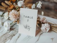 a table number with flowers on it