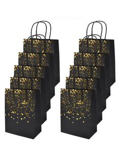 six black and gold gift bags with golden foil sprinkles on the handles