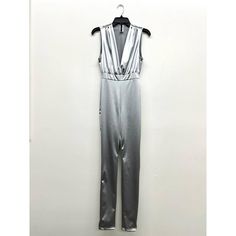 Envelop yourself in the luxury of this Deep V Satin Jumpsuit!Sporty and sexy, it's perfect for a night out, special occasion, or just a club.Available in a dazzling array of colors - Black, Sky Blue, Royal Blue, Silver, White, Orange, and Fuchsia - with solid patterning, discover your slim fit style!Fitted with a Deep V-Neck, sleeveless, and crafted with stretch material that won't sheer, this piece is comfy and chic for every season. Bodice Applique, Love Struck, Satin Jumpsuit, Black Sky, Trendy Boutique, Fabric Sale, Fuchsia Color, Applique Patterns, Custom Dresses