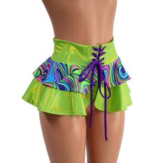 "This is the shortest version of our tiered double ruffle skirt! This 10\" long circle cut skirt has a lace-up at the waistband, and a tiered ruffle, for double the cuteness. The waistband and longer ruffle are made from Neon Lime Holographic, and the short ruffle is Glow Worm.  The laceup tie is Grape holographic. Perfect for matching with our cheekies, shorts and crops, or wear it over leggings The skirt is open below the laceup, so be sure to wear something cute underneath! (or not? ;) ) This Ruffled Bottoms For Summer Costume Party, Ruffled Tiered Skirt For Costume Party, Fitted Green Skirt With Ruffle Hem, Green Ruffled Skirted Skort, Green Ruffled Mini Skirt For Party, Green Ruffled Mini Skort, Fitted Green Mini Skirt With Ruffles, Green Tiered Skirt For Party, Green Ruffled Skort