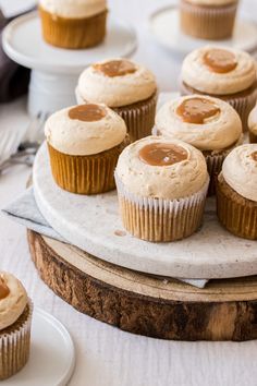 cupcakes with peanut butter frosting on a cake platter, ready to be eaten