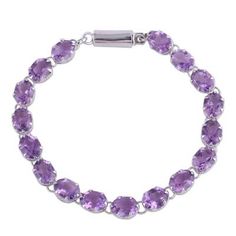 A truly dazzling accessory this tennis-style bracelet is composed of glittering amethysts totaling 25.5 carats. Artisan Alok Jain of India designs the bracelet with rhodium-plated sterling silver accents. Amethyst Tennis Bracelet As A Gift, Formal Purple Amethyst Tennis Bracelet, Amethyst Gemstone Tennis Bracelet Gift, Amethyst Gemstone Tennis Bracelet, Silver Chandelier Earrings, Silver Chandelier, Ruby Pendant, Amethyst Color, Sterling Silver Dangle Earrings