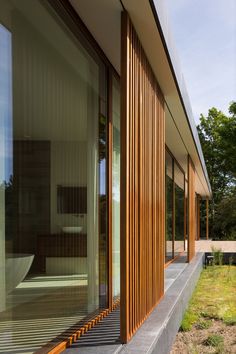 an exterior view of a house with wooden slats