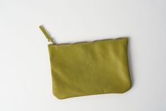 This green leather pouch is handmade from smooth genuine leather. It is perfect to hold your pencils and little items such as coins, telephone charger, lipsticks and little treasures It comes with a durable zipper and without lining. It is possible to order the small leather zipper bag in another color or size, just drop me a message for advice! Green Leather Wallets With Zipper Closure, Green Leather Wallet With Zipper Closure, Green Everyday Pouch Cosmetic Bag, Green Pencil Case With Zipper For Everyday Use, Everyday Green Pouch Cosmetic Bag, Green Pencil Case With Zipper Closure For Everyday Use, Classic Green Rectangular Coin Purse, Green Pencil Case With Zipper Closure, Green Pouch Pencil Case With Zipper