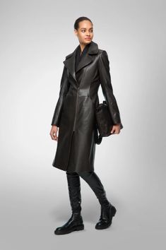 Women's Leather Coat In Black Embrace timeless elegance with our women's leather coat in black. Crafted from genuine sheepskin leather with a semi-aniline finish, it exudes luxury and durability. The coat features a stylish turn-down collar, a zipper closure, and open hem cuffs for a classic look. Practicality meets sophistication with one inside pocket and two side pockets. This black leather coat offers the perfect blend of style and functionality, making it an essential addition to any wardrobe. Outer Shell: Genuine Leather Leather Type: Sheepskin Leather Finish: Semi-aniline Closure Style: Zipper Collar Style: Turn Down Cuffs Style: Open Hem Inside Pockets: One Outside Pockets: Two Side Pocket Color: Black Luxury Leather Outerwear, Sleek Leather Outerwear For Evening, Sleek Leather Evening Outerwear, Luxury Long Leather Workwear Jacket, Luxury Leather Outerwear For Office, Elegant Long Leather Coat For Formal Occasions, Designer Leather Evening Outerwear, Elegant Long Leather Jacket For Formal Occasions, Luxury Leather Evening Outerwear