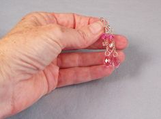 "Gorgeous pink sparkling briolette drops of premium crystal with a touch of aurora borealis and sterling silver. A beautiful and lightweight pair of twinkling pink and sterling. These flirty little earrings are 2 inches (51mm) long including the ear wires, but won't weigh you down. See the matching necklace at https://www.etsy.com/listing/530033829 Free USPS first class domestic shipping on all KBeadsIt jewelry. More details: *Light Rose crystal 13mm x 6.5mm briolettes *6mm Rose crystal bicones Pink Sterling Silver Briolette Earrings, Pink Briolette Sterling Silver Earrings, Pink Sparkling Crystal Earrings Gift, Pink Sparkling Crystal Earrings For Gift, Sparkling Pink Dangle Jewelry, Element Necklace, October Birthstone Jewelry, Pink Swarovski, Buy Bead