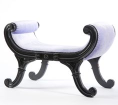 a black bench with white fabric on it's back and foot rests in front of a white background