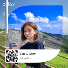 a woman standing next to a fence with windmills in the background and text reading blue & gray angels