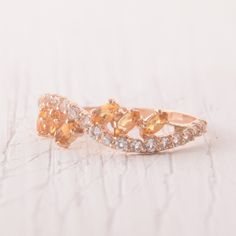 Rose gold wedding band, Citrine ring, Marquise ring, Womens wedding band, Wedding band for her, Dainty Wedding Band, Marquise Wedding band WE OFFER UNLIMITED PERIOD INSTALLMENTS PLAN This is a beautiful, stunning, feminine ring that works well for all occasions, styles, and ages. You will love it! Ring information: Main stone: Citrine Approximate size: 4*2mm (6 stones) Accent stones: White topz Approximate size: 1.5mm (21 stones) Metal type: Gold Metal stamp: 14k Gold Installment Payments We off Rose Gold Sapphire Ring For Wedding With Round Band, Rose Gold Sapphire Ring With Round Band For Wedding, Fine Jewelry Rose Gold Topaz Wedding Ring, Rose Gold Sapphire Wedding Ring With Round Band, Rose Gold Stackable Sapphire Wedding Ring, Stackable Rose Gold Sapphire Ring For Wedding, Stackable Rose Gold Sapphire Wedding Ring, Gold Stackable Rings With Accent Stones For Wedding, Wedding Topaz Rings With Halo Design