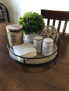 a wooden table topped with dishes and candles