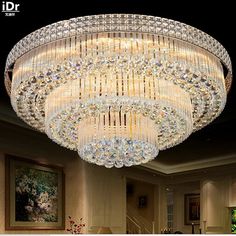 a chandelier hanging from the ceiling in a living room