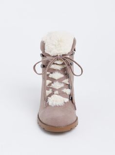 Cozy and cute, these faux suede booties are designed with faux sherpa accents and with a small wedge heel to take you from day to night in style. Our unique fit gives you extra wide width and extra room around your whole foot. EXTRA WIDE WIDTH (WW). Almond toe. Side zip and lace-up closures. Contrast padded faux fur trim. 2. 75” wedge heel. Extra cushioned footbed; textured sole. Man-made materials. Imported extra wide width shoes. The best plus size women's sherpa wedge bootie (ww) flatform & heels in taupe made of suede. Rock your look from Torrid to Festivals like Coachella and Lollapalooza, a concert, a show, or just for fun! Torrid is your destination for cozy fall and winter clothes to keep you warm and comfortable. Synthetic Winter Wedge Heel Boots, Winter Synthetic Wedge Heel Boots, Synthetic Wedge Heel Boots For Winter, Trendy Synthetic Wedge Boots For Winter, Winter Suede Boots With Wedge Heel, Suede Wedge Heel Winter Boots, Suede Wedge Heel Boots For Winter, Winter Suede Wedge Boots With Round Toe, Trendy Winter Boots With Wedge Heel