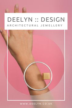 Levitate bangle by DeeLyn :: Design - architectural jewellery designed and handmade by DeeLyn Walsh in her UK studio. This statement bangle is created from silver and brass and is part of the Fragmentation collection. in this collection bold and simple shapes are brought together to create minimal, yet playful architectural structures with optical illusions emerging as a central theme.