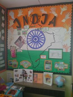 a classroom wall decorated with pictures and posters