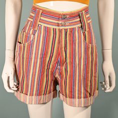 Super cute high waist shorts with a wide waistband, wide legs, and pockets. Multi-colored striped pattern - The colors are bright and clear.  Wide waist band - 2 3/4" with 2 metal buttons. Rolled cuffs on the leg. Belt loops. LABEL: Nada Nuff, Contempo Casuals. Made in Hong Kong.  SIZE: Marked 9  Refer to measurements for an accurate fit. All sizes are approximate. Waist: 27" Hip: 40 1/2" Length: 16" Inseam: 3" Rise: 11 1/2" Mannequin measurements:   Size 2, Bust 33"   Waist 24"   Hips 34" CONDITION: Excellent, pre-owned shorts.  COLOR: Multicolor- yellow, red, green, orange, purple + more. MATERIAL: Cotton, metal zipper. CARE: Machine wash OK.  Domestic Shipping: Priority Mail including tracking and insurance.   NO RETURNS: Vintage items are often fragile or one of a kind, our items are F Trendy Striped Shorts With Built-in Shorts, Retro High-waisted Shorts For Summer, Retro High Waist Summer Shorts, Retro High-waist Summer Shorts, Retro Summer Shorts, Striped High Waist Shorts With Pockets, High Waist Striped Shorts With Pockets, Retro Shorts With Pockets, Striped High-waist Shorts With Pockets