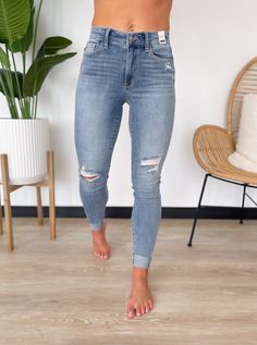 You will style comfortable and trendy all season long in the Maddie Jeans by Judy Blue! Features distressed detailing and rolled hemlines for a stylish and edgy look. They also feature a medium wash with a high-rise waistband and a zip and button closure. Perfect to pair with sweaters, blouses and tank tops! High Rise Light Wash Jeans With Zipper Closure, Light Wash High Rise Jeans With Zipper Closure, Everyday Ripped Washed Blue Bottoms, High Rise Medium Wash Bottoms With Zipper Closure, High Rise Bottoms With Zipper Closure In Medium Wash, Medium Wash Bottoms With Zipper Closure For Fall, Fall Medium Wash Bottoms With Zipper Closure, High Rise Medium Wash Jeans With Zipper Closure, High Rise Jeans With Zipper Closure In Medium Wash