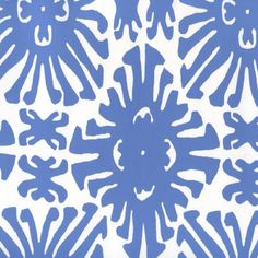 a blue and white wallpaper with an intricate design in the center, on top of it