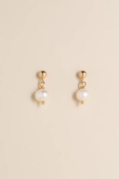 Elegant, minimal and beautiful, the Circe pearl drop are a timeless yet stylish pair of earrings, that will match any outfit and elevate your already amazing style. *Due to the unique nature of the pearls, the colors and shapes may vary slightly from the picture shown. Details: Material: 14k gold-filled Handcrafted Gemstone: Natural baroque pearl Hypoallergenic and Tarnish resistant Water Resistant Classic Pearl Pendant Earrings In 14k Gold Filled, Classic 14k Gold-filled Pearl Pendant Earrings, Classic 14k Gold Filled Pearl Pendant Earrings, Formal Minimalist Pearl Earrings With Charm, Pear-shaped Pearl Pendant Earrings In Minimalist Style, Minimalist Teardrop Pearl White Earrings, Minimalist Pearl Earrings With Charm, Elegant Everyday Pearl Earrings With Charm, Minimalist Pearl Drop Earrings In Pearl White