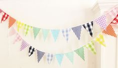 a multicolored checkered bunting hangs from the ceiling