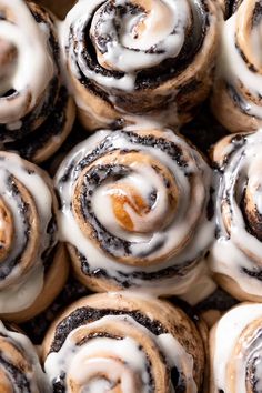 there are many cinnamon rolls with icing on them