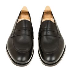 UNLINED PENNY LOAFERS IN BLACK FUNCHAL Timeless Black Slip-on Loafers, Black Calf Leather Loafers With Almond Toe, Black Cap Toe Loafers For Galas, Black Cap Toe Loafers With Goodyear Welt, Black Goodyear Welted Loafers In Calf Leather, Elegant Black Loafers With Leather Lining, Luxury Black Closed Toe Loafers, Timeless Black Leather Shoes, Elegant Black Cap Toe Loafers