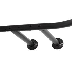 a close up of a metal bar with two black wheels on the back of it