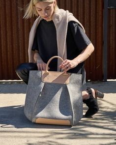 Inspired by elements of maritime architecture, the Frankie tote challenges the notion of the typical day bag (https://graf-lantz.com/collections/womens). With its luxe merino wool felt construction, strong vegetable tanned leather handles, and adjustable leather shoulder strap, the Frankie tote strikes the perfect balance between functionality and art. Two Pockets add convenience and magnetic top closure, security. The Frankie Tote is our original iconic bag that has been featured in the likes of Vogue, Magnolia Journal & Refinery 29. The Tote is a commuter-friendly oversized tote/crossbody (https://graflantz.com/collections/crossbody) iteration of our dramatic design with premium hand-finishing for an elegant execution.


 To add a little extra flare and make your bag even more unique, wh Maritime Architecture, Graf Lantz, Refinery 29, Magnolia Journal, Wool Tote, Felt Tote, Oversized Tote, Iconic Bags, Day Bag