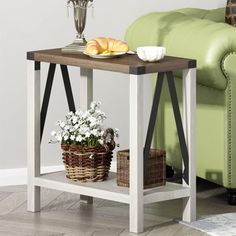 a table that has some food on it and a vase with flowers in front of it