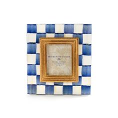 a blue and white checkered photo frame with an ornate gold border around the edges