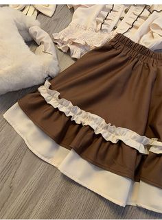 The price is for a skirt only, others are not included.   	 		 			Size 			S 			M 			L 			XL 		 		 			Waist 			62 			65 			68 			71 		 		 			Full Length 			38 			39 			40 			41 		 		 			Hem Circumference 			182 			186 			190 			194 Brown Ruffled Flared Skirt, Brown Ruffled Tiered Mini Skirt, Spring Brown Skirt With Ruffles, Brown Ruffled Skirt, Spring Brown Ruffled Skirt, Brown Ruffled Skirt For Spring, Brown Ruffled Mini Skirt For Summer, Summer Flared Mini Skirt In Brown, Brown Ruffled Skirt For Summer