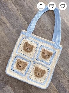 a crocheted bag with teddy bears on the front and sides, sitting on a wooden floor