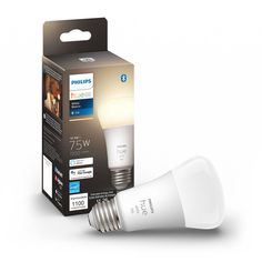 the philips smart light bulb is in its box and next to it's packaging