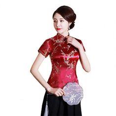 Women Cheongsam Shirt Chinese Style Plum Print Summer Autumn Exquisite Buckles Stand Collar Cheongsam Top Wedding Description: Slim shirt designed in Chinese style cheongsam, which very and has ethnic style. With a plum blossom print design, this shirt very artistic and shows the noble and elegant feminine temperament. shirt can matched with a large hem skirt or long pants or short skirt. And it makes you more eye-catching and popular. Short sleeve cheongsam shirt made of high quality polyester Cheongsam Shirt, Cheongsam Top, Stand Collar Top, Slim Blouse, Elegant Feminine, Black Wedding, Cheongsam, Ladies Tops Fashion, Ethnic Fashion