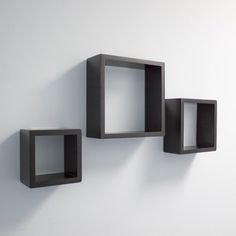 three cubes are mounted on the wall