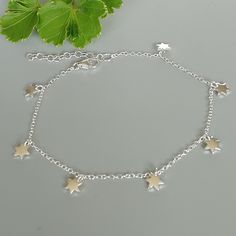 Sterling silver chain bracelet with star charms. Length:6 to 7 inches Flower charm: 4 x 4 mm. Weight: 1.5 gm This bracelet is made of 925 hypoallergenic sterling silver. Can be packaged in a gift box. I can include a personal message from you if needed You are welcome to contact me at... bhavnakwintra1956@gmail.com For more beautiful pieces from my shop, please browse 👇 TOE RINGS: https://www.etsy.com/your/shops/TheSilverGame/tools/listings/section:27020628,view:table EAR HOOPS: https://www.ets Dainty Sterling Silver Bracelet With Star Charm, Silver Star-shaped Dainty Jewelry, Dainty Nickel-free Silver Charm Bracelet, Dainty Handmade Silver Charm Bracelet, Dainty Star Charm Bracelet Gift, Sterling Silver Bracelets With Star Charm As A Gift, Handmade Silver Dainty Charm Bracelet, Silver Star-shaped Adjustable Chain Bracelet, Dainty Silver Hypoallergenic Charm Bracelet