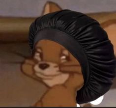 an animated squirrel wearing a black turban and looking at the camera while standing in front of a cartoon character