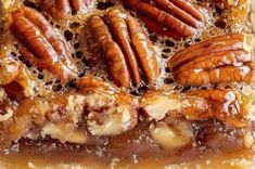 there is a piece of pie with pecans on top and nuts in the middle