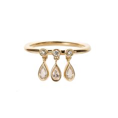 Obsessed with the dangles! A playful take on a classic wedding band, Nora takes it to a whole new level with three pear-cut diamond drops that move and sparkle as you move and sparkle 14k yellow gold pear-cut diamond drops all diamonds are conflict-free band measures 1.5mm wide, diamond drops are 6mm tall This piece is Dangle Ring, All That Glitters Is Gold, Classic Wedding Band, Pear Cut Diamond, Diamond Drops, Classic Wedding, Jewelry Inspo, Earring Necklace, Ring Necklace