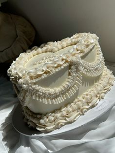 a white cake sitting on top of a table