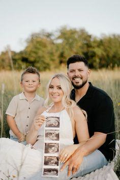 a man and woman pose for a photo with their son