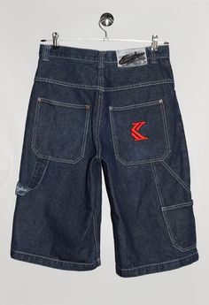 "Karl Kani jean shorts, with brand logo embroidery in red on the back pocket. - Size tag: Please always check measurements before buying. Tag reads size 30, Men's S - Measurements (laying flat): Waist: 15.5\" Outleg: 26\" Inleg: 14\" Thigh: 13.5\" Rise: 13\" Leg opening: 11.5\" -Wear: /Please see images for details/ Good vintage condition. The leather tag on the back is peeling. - Fabric: 100% Cotton *All of our items are preloved pieces so some signs of natural wear and age are to be expected. Please look through the photos carefully to check if the condition is to your satisfaction.  *All efforts are made to show any defects however small imperfections may be missed. In cases that we've missed a major flaw, please remember that we are still human and make mistakes, please contact us firs Dark Wash Jean Shorts For Streetwear, Dark Wash Five-pocket Shorts For Streetwear, Dark Wash Five Pocket Shorts For Streetwear, Streetwear Shorts With Five Pockets, Five-pocket Streetwear Shorts, Streetwear Jean Shorts With Hip Pockets, Hip Pocket Jean Shorts For Streetwear, Dark Wash Cotton Jean Shorts With Hip Pockets, Dark Wash Shorts With Pockets For Streetwear