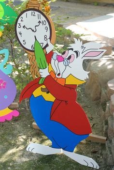 an image of a rabbit holding a clock in its hand and another bunny on the other side