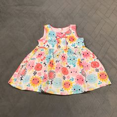 Nwt Girls Koala Baby Sunflower Dress Sz 6m Cute Adorable Happy Face Sunflower Design Dress. Has Buttons On The Back With Bow Sunshine Dress This Is A Very Cute Dress For Summer Or Spring For Picnics Or Summer Outing. Perfect For Photos Or Vacations On A Sunny Beach. Great For Baby Shower Gift! Great For Spring Or Summer Time! New To Poshmark? Use “Shopstylenow” At Registration And Get $10 Credit After Your First Purchase. Cute Spring Dress With Button Closure, Cute Sleeveless Buttoned Dress, Cute Pink Dresses With Buttons, Cute Pink Dress With Buttons, Pink Floral Print Sundress For Playtime, Cute Sleeveless Dress With Button Closure, Cotton Dresses With Buttons For Playtime, Spring Playdate Dresses With Buttons, Spring Dresses With Buttons For Playdate