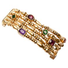 Seidengang bracelet of five strands of gold beads of varying shapes and sizes. Interspersed with the beads are square; round; oval and rectangular stones that include tourmaline; citrine and amethyst. The bracelet is 7 1/8 inches long and 1 inch wide. It has a foldover clasp. Dragonfly Bracelet, Retro Bracelet, Expensive Jewelry Luxury, Modern Bracelets, Gemstone Bangle, Gold Armband, Multi Strand Bracelet, Bangles Jewelry Designs, Gold Bead Necklace