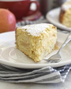 a piece of cake sitting on top of a white plate with a fork in it