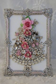 the shabby chic home decor is featured with pink flowers and pearls on it