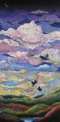 a quilted landscape with birds flying in the sky