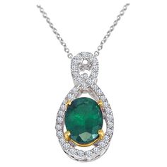 This beautiful pendant has a 1.26 carat oval cut emerald center, inside a halo of round white diamonds, with additional round diamonds on the bail (total diamond weight 0.22 carats). The setting is in 18k White Gold, with 18k Yellow Gold surrounding the center emerald. Emerald: Oval cut, 1.26 carats Diamond: Round cut, 0.22 carats Set in 18k White and Yellow Gold. Chain is 18", with an additional closure loop at 16" At DiamondTown, we take immense pride in presenting our extensive range of exqui Yellow Gold Chain, Women Diamond, White Diamonds, Diamond Pendant, Oval Cut, Diamond White, Gold Chain, Round Cut, Round Diamonds